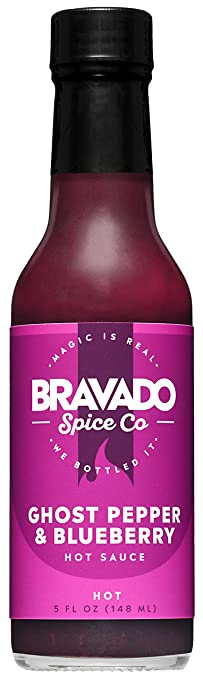 Bravado Spice Co's Ghost Pepper & Blueberry Hot Sauce is a fruity and spicy blend of blueberries, raspberries, ghost peppers, and black pepper. With a medium to hot heat level, it's versatile and pairs well with grilled meats, pizza, and even ice cream.