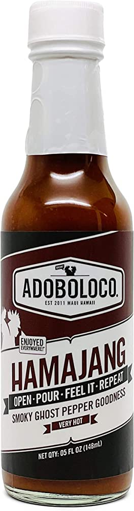 Adoboloco Hamajang is a Hawaiian hot sauce with a unique flavor profile that's a blend of sweet and spicy. Made with a combination of chili peppers, garlic, sea salt, apple cider vinegar, and organic sugar, this hot sauce has a sweet and tangy taste that's balanced out by a spicy kick.