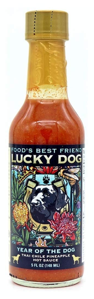 Year of the Dog Thai Chile Pineapple hot sauce by Lucky Dog is a unique blend of sweet and spicy flavors that's perfect for adding a tropical twist to your favorite dishes. Made with pineapple, Thai chilies, and a blend of spices, this hot sauce is both tangy and fiery. It's great for adding to stir-fries, marinades, and even as a dipping sauce for your favorite appetizers. 